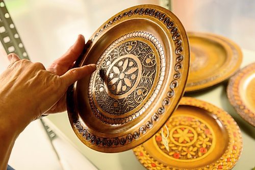 Mike Sudoma/Free Press
Wooden plates from Poland with decorative brass etchings the basement of the Ogniwo Polish Museum
May 24, 2024