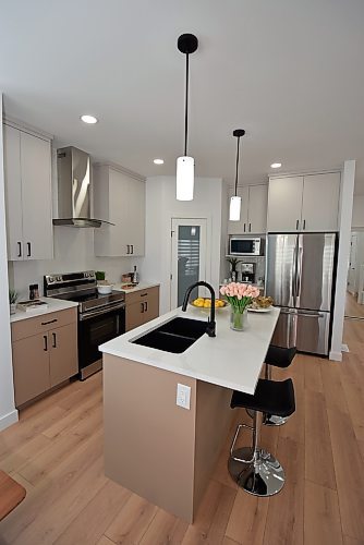 Photos by Todd Lewys / Free Press
A smart combination of traditional and modern finishes gives the island kitchen a wonderful modern farmhouse feel.