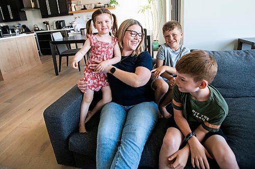 MIKAELA MACKENZIE / FREE PRESS

Steph Seier and her kids, Brooklyn (four, left), Theo (six), and  Connor (nine), at their home on Thursday, June 13, 2024. Steph is a full time nurse who has three kids and got so desperate for child care she joined the board of her kids' daycare, became president, and pushed for a new school age child care centre -- which was eventually built.

For Katrina story.

