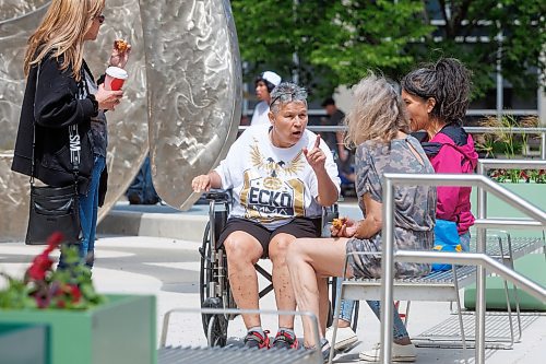 MIKE DEAL / FREE PRESS
Sandra Guiboche (in wheelchair), sits outside the Law Courts Building during a break for lunch in her trial Wednesday. Guiboche has alleged to have been dealing drugs in the Point Douglas area off and on for 25 years and was the primary target of a lengthy police investigation dubbed Project Matriarch.
240619 - Wednesday, June 19, 2024.