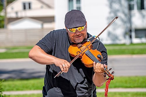 NIC ADAM / FREE PRESS
Jason Lepine plays the fiddle during the Manitoba M&#xe9;tis Federations commemoration of the 208th anniversary of the Victory at Frog Plain at the Seven Oaks Monument in Winnipeg Wednesday morning.
240619 - Wednesday, June 19, 2024.

Reporter: ?