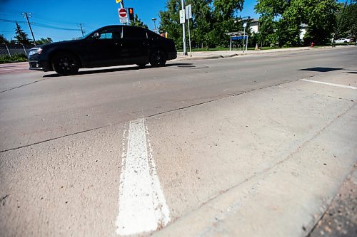 MIKAELA MACKENZIE / FREE PRESS

Faded crosswalk painting, which is behind this year due to wet weather and a malfunctioning machine, on Chancellor Drive at the SW Transitway on Wednesday, June 19, 2024. 

For Malak story.

