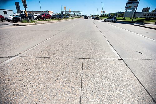 MIKAELA MACKENZIE / FREE PRESS

Faded lane painting, which is behind this year due to wet weather and a malfunctioning machine, on Kenaston at Sterling Lyon Parkway on Wednesday, June 19, 2024. 

For Malak story.

