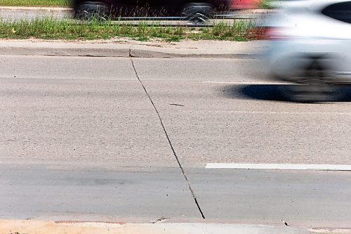 MIKAELA MACKENZIE / FREE PRESS

Faded lane painting, which is behind this year due to wet weather and a malfunctioning machine, on Kenaston at Sterling Lyon Parkway on Wednesday, June 19, 2024. 

For Malak story.

