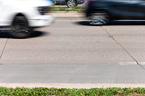 MIKAELA MACKENZIE / FREE PRESS

Faded lane painting, which is behind this year due to wet weather and a malfunctioning machine, on Kenaston at Sterling Lyon Parkway on Wednesday, June 19, 2024. 

For Malak story.

