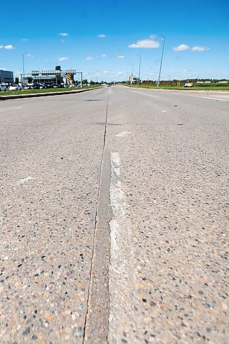 MIKAELA MACKENZIE / FREE PRESS

Faded lane painting, which is behind this year due to wet weather and a malfunctioning machine, on Kenaston at Sterling Lyon Parkway on Wednesday, June 19, 2024. 

For Malak story.

