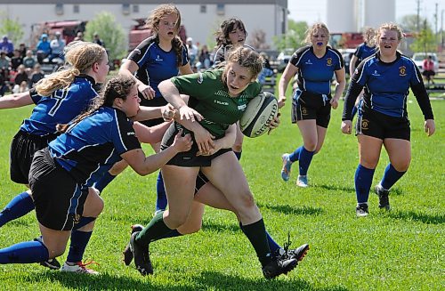 Dauphin Clippers ball carrier Raylyn Koshowski (8) is tackled by by a group of Souris Sabres players during provincial high school rugby action in Dauphin. Koshowski has won back-to-back provincial high school rugby championships. (Jules Xavier/The Brandon Sun)