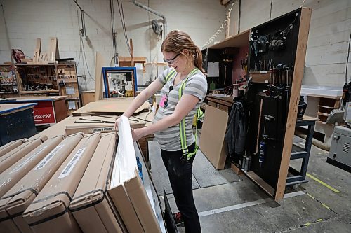 Ruth Bonneville / Free Press

BIZ - Loewen Windows

Photo of Chelsea Friesen working on assembling packaging material at Loewen Windows.  Her father, Vern Rempel who has worked for the company for 34 years, works on specialty windows not far from where she works.  

Loewen Windows in Steinbach,  June 21 &quot;Made in Manitoba&quot; article:

Selection of photos taken at the large window manufacturing plant in Steinbach Manitoba including: wall at Loewen Windows that displays photos of employees that have worked at the company for 25+ years and photos of employees working in their large manufacturing facility.

Aaron Epp story

June 18th, 2024