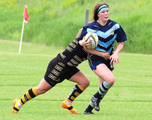 Emily Van Mol of the Brandon Barbarians runs with the ball as a Wasps defender hauls her down during a Women's Premier League game at John Reilly Field last weekend. (Photos by Perry Bergson/The Brandon Sun)