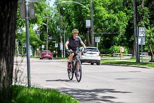 MIKAELA MACKENZIE / FREE PRESS

Cyclist Mark Gray on Wolseley Avenue, where the speed is reduced to 30km/h, on Thursday, June 20, 2024. 

For Tyler story.

