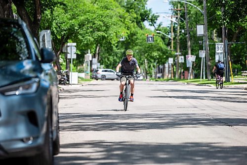 MIKAELA MACKENZIE / FREE PRESS

Cyclist Mark Gray on Wolseley Avenue, where the speed is reduced to 30km/h, on Thursday, June 20, 2024. 

For Tyler story.

