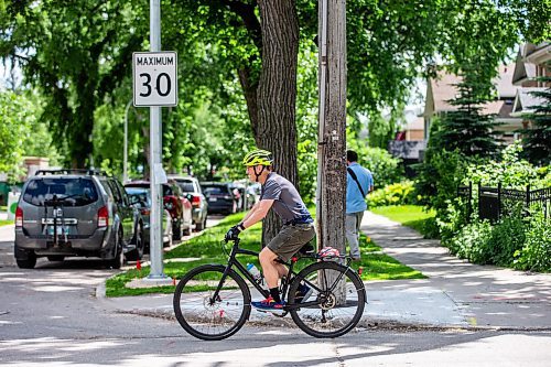 MIKAELA MACKENZIE / FREE PRESS

Cyclist Mark Gray on Wolseley Avenue, where the speed is reduced to 30km/h, on Thursday, June 20, 2024. 

For Tyler story.

