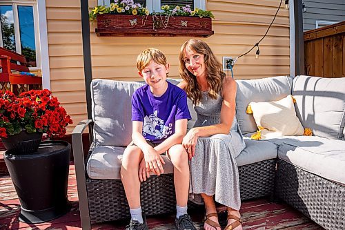 NIC ADAM / FREE PRESS
Sunshine Fund winners Jack Montgomery and his mom, Erin, pose for a photo in their backyard Thursday afternoon.
240620 - Thursday, June 20, 2024.

Reporter: Jura