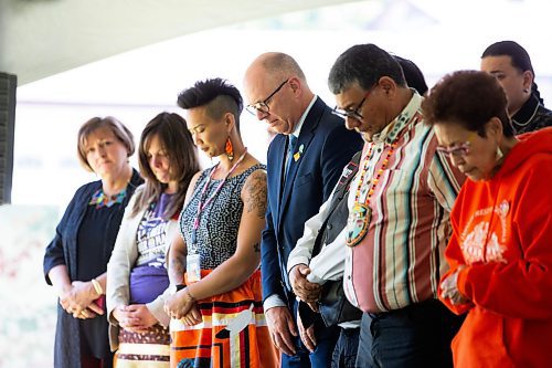 MIKAELA MACKENZIE / FREE PRESS

Dignitaries, including mayor Scott Gillingham (centre),  stand for a moment of silence in remembrance of the children who didn&#x574; come home during the Abinojii Mikanah renaming ceremony on Friday, June 21, 2024. 

For Joyanne story.

