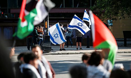 JOHN WOODS / WINNIPEG FREE PRESS
About 150 Palestinian supporters rally outside City Hall and throughout the Exchange District as six Israel supporters gather on the opposite side of Main Street in Winnipeg Monday, October 9, 2023. 

Reporter: searles