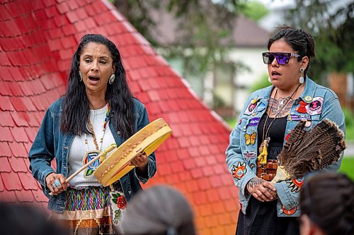 NIC ADAM / FREE PRESS
Amber Flett (left) and Kristen McKay play a hand drum and sing at a memorial gathering for Rebecca Contois at Kildonan Park in conjunction with National Indigenous Peoples Day Friday evening. 
240621 - Friday, June 21, 2024.

Reporter: Erik