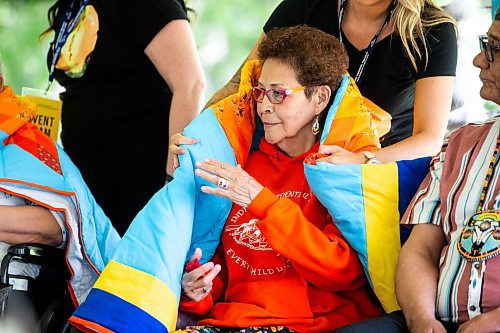 MIKAELA MACKENZIE / FREE PRESS

Elder Betty Ross recieves a blanket during the Abinojii Mikanah renaming ceremony on Friday, June 21, 2024. 

For Joyanne story.

