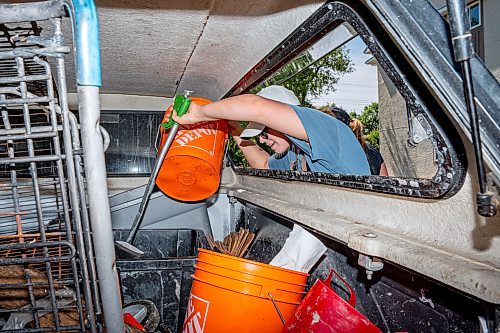 NIC ADAM / FREE PRESS
Save Our Seine is celebrating 30 years of cleaning up the Seine River and having river crews operating on the water removing garbage.
Save Our Seine River Keeper, Nastassja Loiselle, grabs some gear from the back of their truck.
240621 - Friday, June 21, 2024.

Reporter: Matt Frank