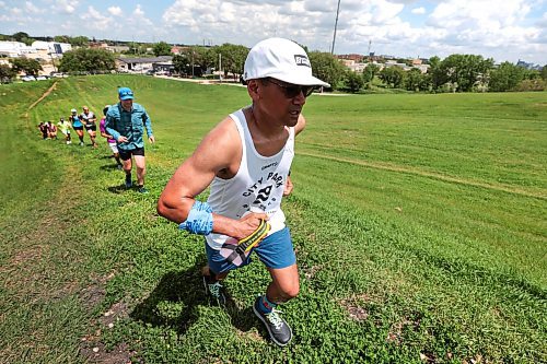 Ruth Bonneville / Free Press

Standup - Mindful Movement 

Junel Malapad, an ultramarathon runner and mental health champion.heads a group of runners along the hills  at Westview Park, commonly known as &#x487;arbage Hill&#x4e0;to raise funds for youth mental health services on Friday.  

The run which spanned over 12 hours, from 6 am Friday morning and ends 12 hours later at 6:30pm has participants running a portion of the 12 hours run with funds going to CMHA Manitoba. 

 Junel Malapad,  an ultramarathon runner and mental health champion., has raised over $62,000 over the last ten years  for CMHA Manitoba and Winnipeg and is celebrating his 10th run with hopes of raising $10,000 from supporters from the event.  

June 21st, 2024