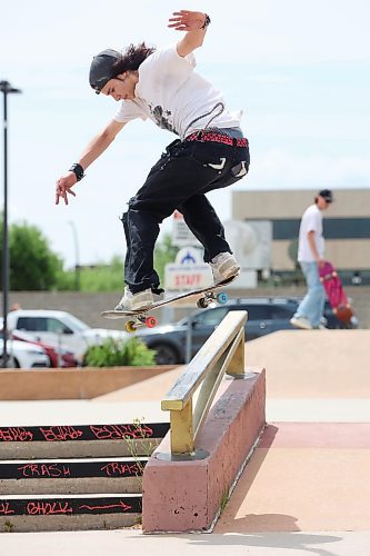 07062024
David Ledoux ollies into a back-lipslide on a rail at the Kristopher Campbell Memorial Skatepark in Brandon on Friday during Go Skateboarding Day hosted by Recovery Skateshop. The local celebration of the international Go Skateboarding Day included best trick contests, give-aways, and evening entertainment at Black Wheat Brewing and drew dozens of skateboarders to the skatepark.  
(Tim Smith/The Brandon Sun)