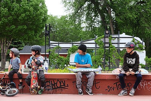 07062024
Kids take a break while skateboarding at Kristopher Campbell Memorial Skatepark in Brandon on Friday during Go Skateboarding Day hosted by Recovery Skateshop. The local celebration of the international Go Skateboarding Day included best trick contests, give-aways, and evening entertainment at Black Wheat Brewing and drew dozens of skateboarders to the skatepark.  
(Tim Smith/The Brandon Sun)