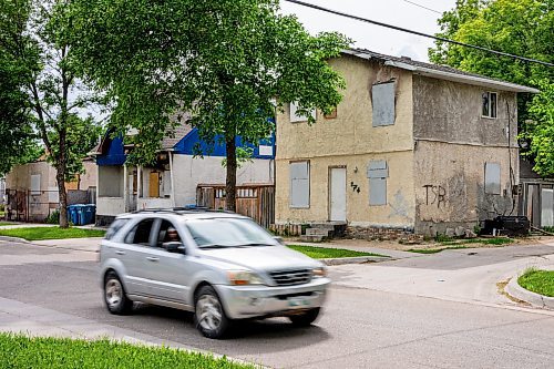 NIC ADAM / FREE PRESS
Four burned houses in the William Whyte community sit in a row, vacant, along Powers Ave Friday afternoon.
240621 - Friday, June 21, 2024.

Reporter: Katie