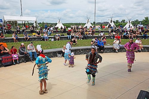 21062024
Young women demonstrate a jingle dance as part of a Powwow demonstration for visitors to National Indigenous Peoples Day 2024 celebrations at the Riverbank Discovery Centre on Friday. The celebration included powwow demonstrations, a talent show, music, bannock and other activities.  
(Tim Smith/The Brandon Sun)