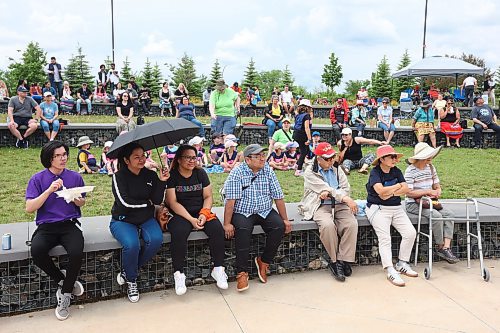 21062024
Vsitors to National Indigenous Peoples Day 2024 celebrations at the Riverbank Discovery Centre watch the afternoon entertainment on Friday. The celebration included powwow demonstrations, a talent show, music, bannock and other activities.  
(Tim Smith/The Brandon Sun)