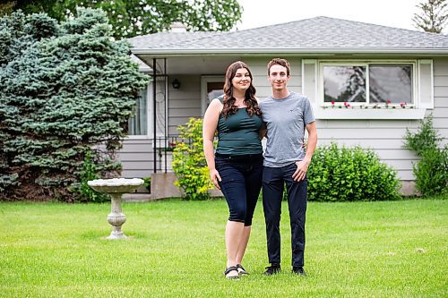 MIKAELA MACKENZIE / FREE PRESS

First-time home buyers Taylor Sumner and Evan Boychuk with their house, which they took posession of three weeks ago, on Friday, June 21, 2024. In a hot housing market with bidding wars now the norm, they managed to find this diamond in the rough and paid under asking price.

For Josh story.

