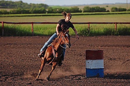 19062024
Melanie Lund, from Norway, rounds a barrel atop a horse during the weekly Thursday evening barrel racing and pole bending jackpots at Lucky Break Ranch southwest of Rivers. (Tim Smith/The Brandon Sun)