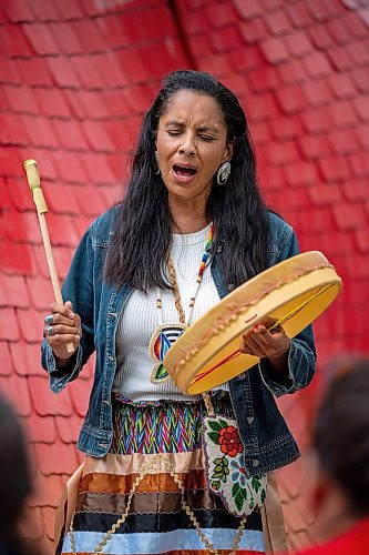 NIC ADAM / FREE PRESS
Amber Flett, a family friend of the Contois, plays a hand drum at a memorial gathering for Rebecca Contois at Kildonan Park in conjunction with National Indigenous Peoples Day Friday evening. 
240621 - Friday, June 21, 2024.

Reporter: Erik