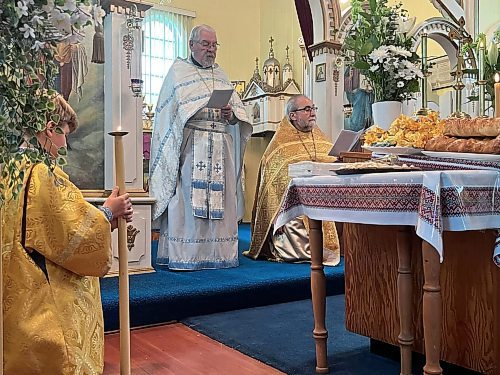 While Father Mel Slashinsky (left) and Winnipeg's Father Taras Udod lead the congregation during the service that celebrated the 100th anniversary of the Ukrainian Orthodox Church of the Holy Ghost on the corner of Stickney Avenue and 11th Street North in Brandon. (Michele McDougall/The Brandon Sun)   