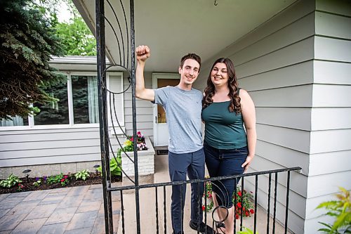 MIKAELA MACKENZIE / FREE PRESS

First-time home buyers Taylor Sumner and Evan Boychuk with their house, which they took posession of three weeks ago, on Friday, June 21, 2024. In a hot housing market with bidding wars now the norm, they managed to find this diamond in the rough and paid under asking price.

For Josh story.

