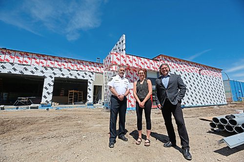 Acting Deputy Chief Greg Hebert with the Brandon Police Service, left, stands with Project manager Stefani Lynch with the City of Brandon and Brandon Mayor Jeff Fawcett outside the nearly completed construction of the new detention cell addition to BPS headquarters along 10th Street on Monday afternoon. (Matt Goerzen/The Brandon Sun)