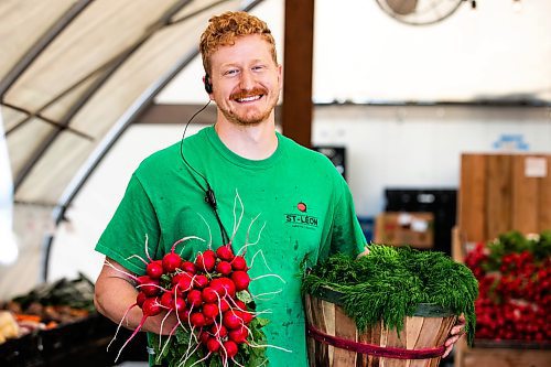 MIKAELA MACKENZIE / FREE PRESS

Colin Rémillard, co-owner of Jardins St-Léon Gardens, with local radishes and dill on Monday, June 24, 2024.

For Matt story.

