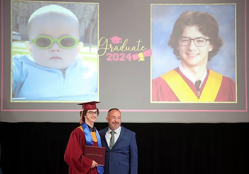 24062024
Graduate Tanner Heuchert poses for photos with Principal Bryce Ridgen under a photo of Tanner as a young child after receiving his diploma during Crocus Plains Regional Secondary School&#x2019;s 2024 Convocation at the Keystone Centre on Monday.
(Tim Smith/The Brandon Sun)