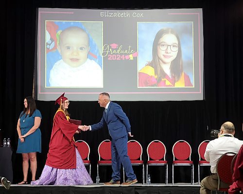 24062024
Graduate Elizabeth Cox shakes hands with Principal Bryce Ridgen after receiving her diploma during Crocus Plains Regional Secondary School&#x2019;s 2024 Convocation at the Keystone Centre on Monday.
(Tim Smith/The Brandon Sun)