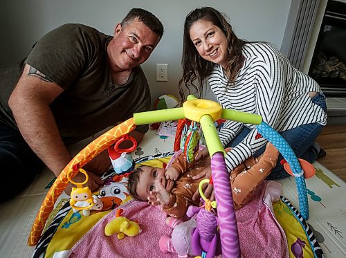 JOHN WOODS / FREE PRESS
Tim and Jaclyn Blazanovic are photographed with their baby Amelia in their home in Stoney Mountain Monday, June 24, 2024. The couple had their baby with a surrogate and say they are not receiving extended union benefits because they did not have a natural birth.

Reporter: joyanne