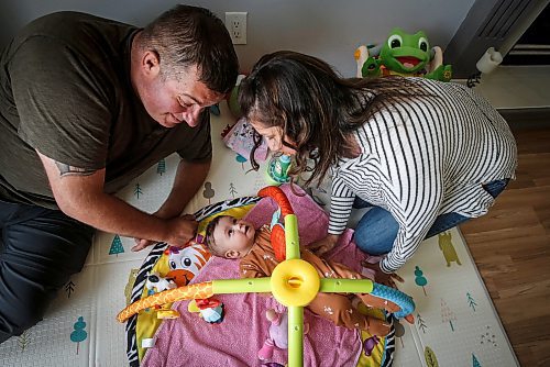 JOHN WOODS / FREE PRESS
Tim and Jaclyn Blazanovic are photographed with their baby Amelia in their home in Stoney Mountain Monday, June 24, 2024. The couple had their baby with a surrogate and say they are not receiving extended union benefits because they did not have a natural birth.

Reporter: joyanne