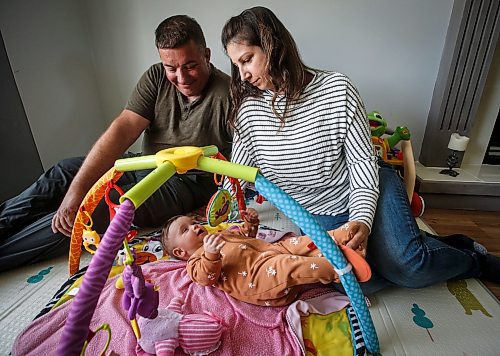 JOHN WOODS / FREE PRESS
Tim and Jaclyn Blazanovic are photographed with their baby Amelia in their home in Stoney Mountain Monday, June 24, 2024. The couple had their baby with a surrogate and say they are not receiving extended union benefits because they did not have a natural birth.

Reporter: joyanne