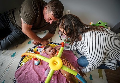 JOHN WOODS / FREE PRESS
Tim and Jaclyn Blazanovic are photographed with their baby Amelia in their home in Stoney Mountain Monday, June 24, 2024. The couple had their baby with a surrogate and say they are not receiving extended union benefits because they did not have a natural birth.

Reporter: joyanne