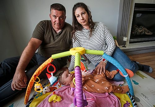 JOHN WOODS / FREE PRESS
Tim and Jaclyn Blazanovic are photographed with their baby Amelia in their home in Stoney Mountain Monday, June 24, 2024. The couple had their baby with a surrogate and say they are not receiving extended union benefits because they did not have a natural birth.

Reporter: joyanne