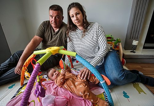 JOHN WOODS / FREE PRESS
Tim and Jaclyn Blazanovic are photographed with their baby Amelia in their home in Stoney Mountain Monday, June 24, 2024. The couple had their baby with a surrogate and say they are not receiving extended union benefits because they did not have a natural birth.

Reporter: joyanne