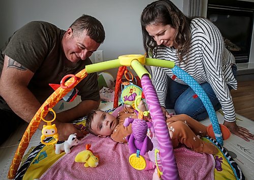 JOHN WOODS / FREE PRESS
Tim and Jaclyn Blazanovic are photographed with their baby Amelia in their home in Stoney Mountain Monday, June 24, 2024. The couple had their baby with a surrogate and say they are not receiving extended union benefits because they did not have a natural birth.

Reporter: joyanne