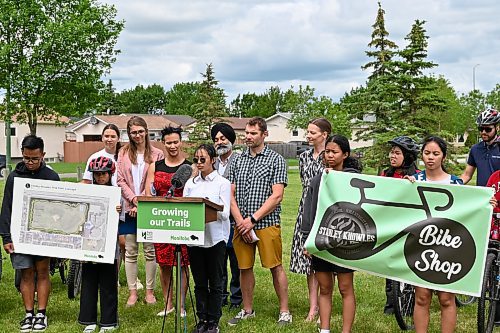 Matt Frank / Free Press
Ella Quinto (centre), a student at &#xc9;cole Stanley Knowles School, speaks at an announcement for the construction of the new Fairgrove Park Community Trail, alongside guidance counselor, Luke Barr (centre right) on Tuesday, June 25. 
240625 - Tuesday, June 25, 2024.