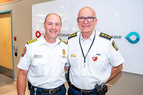 NIC ADAM / FREE PRESS
Winnipeg Fire and Paramedic Service Chief, Christian Schmidt, and Winnipeg Police Service Deputy Chief, Art Stannard, pose for a photo shortly before the first round of blood was drawn Tuesday afternoon. 
240625 - Tuesday, June 25, 2024.

Reporter: Jura