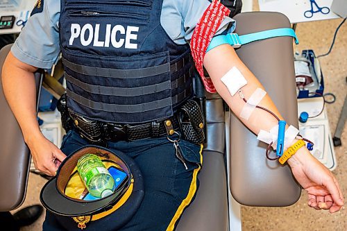 NIC ADAM / FREE PRESS
Manitoba RCMP Media Relations Officer, Corporal Julie Courchaine, gives blood at this year&#x2019;s Sirens for Life campaign at Canadian Blood Services Tuesday afternoon. 
240625 - Tuesday, June 25, 2024.

Reporter: Jura