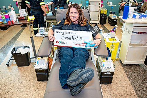 NIC ADAM / FREE PRESS
Winnipeg Fire and Paramedic Service Public Information Officer, Erin Madden, poses for a photo shortly before giving blood at this years Sirens for Life campaign at Canadian Blood Services Tuesday afternoon. 
240625 - Tuesday, June 25, 2024.

Reporter: Jura