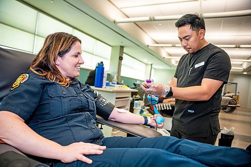 NIC ADAM / FREE PRESS
Winnipeg Fire and Paramedic Service Public Information Officer, Erin Madden, getting ready to give blood at this years Sirens for Life campaign at Canadian Blood Services Tuesday afternoon. This was Maddens 7th time giving blood.
240625 - Tuesday, June 25, 2024.

Reporter: Jura