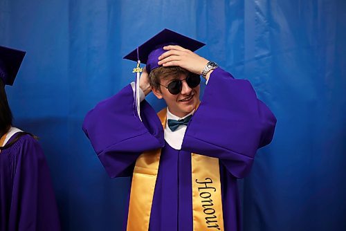 25062024
Graduate Yurii Stasyk adjusts his mortarboard prior to Vincent Massey High School&#x2019;s 2024 Convocation at the Keystone Centre on Tuesday.
(Tim Smith/The Brandon Sun)